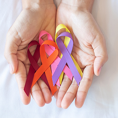 Hands holding awareness ribbons