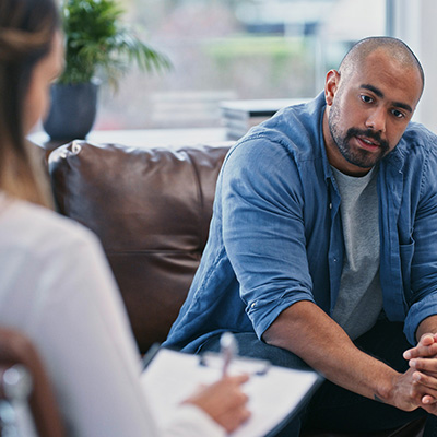 Man talking with someone with a clipboard