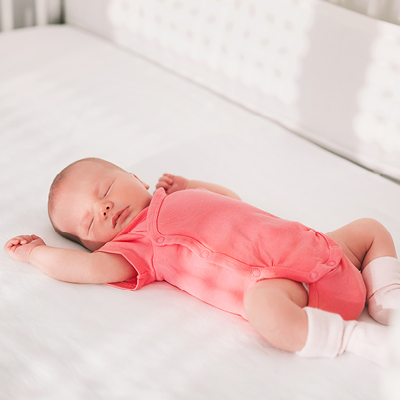 Baby asleep in crib