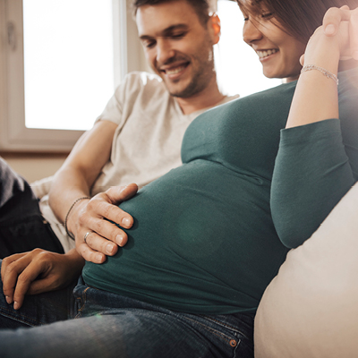 A pregnant couple sitting together