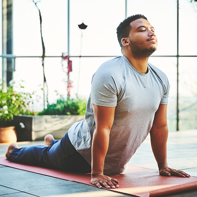 African American man doing yoga