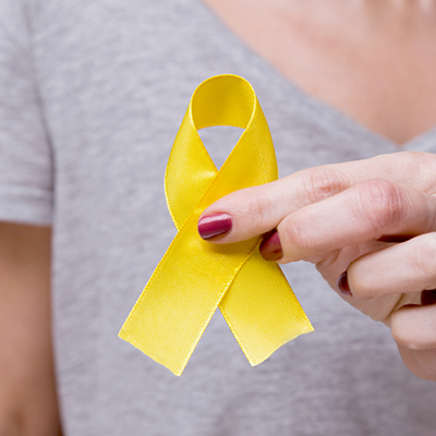 person holding yellow ribbon