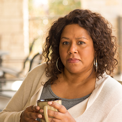 African American woman holding a mug