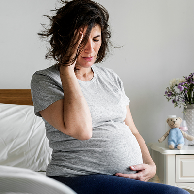 Pregnant woman suffering from morning sickness 