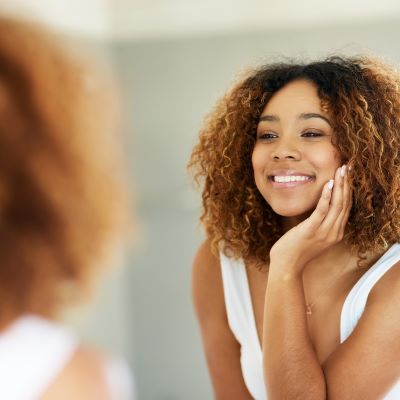 Woman looking in mirror