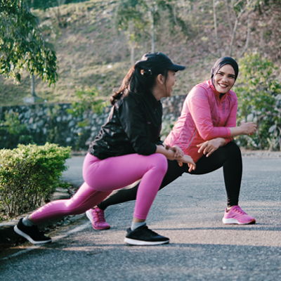 2 women stretching before running