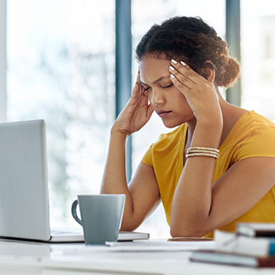 woman holding her head