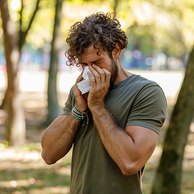 man sneezing