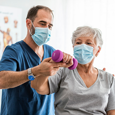 women going through a physical therapy exercise 