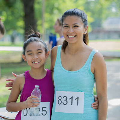 beginners and seasoned runners Mom and daughter getting ready for marathon