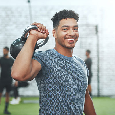 Young man holding weights