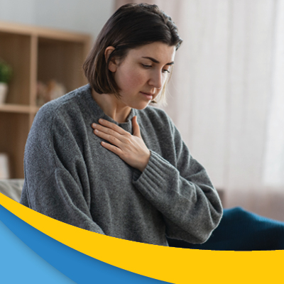 Woman holding their hand to their chest