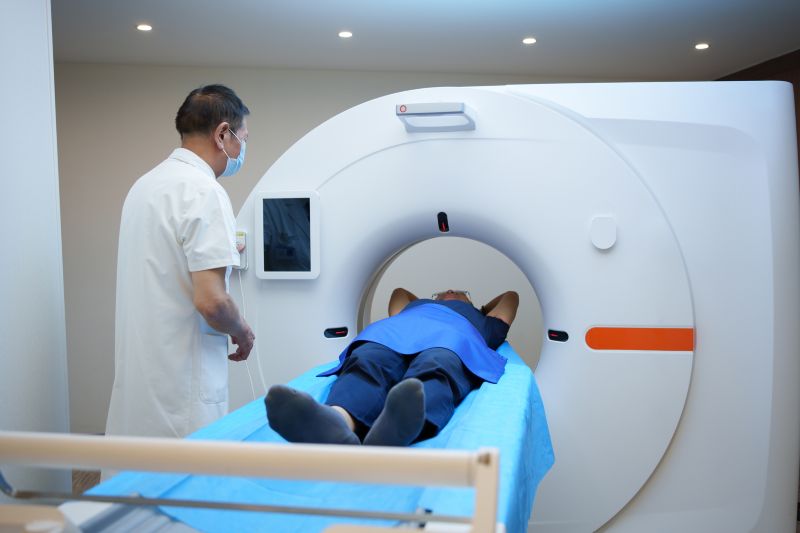 Patient and doctor using imaging machine