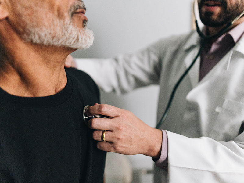 doctor listening to patient's heart