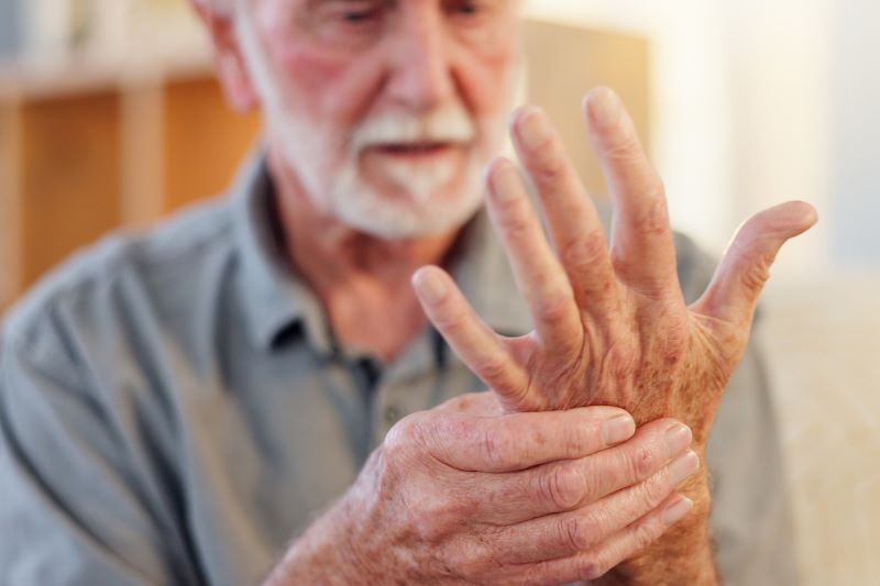 man looking at hand