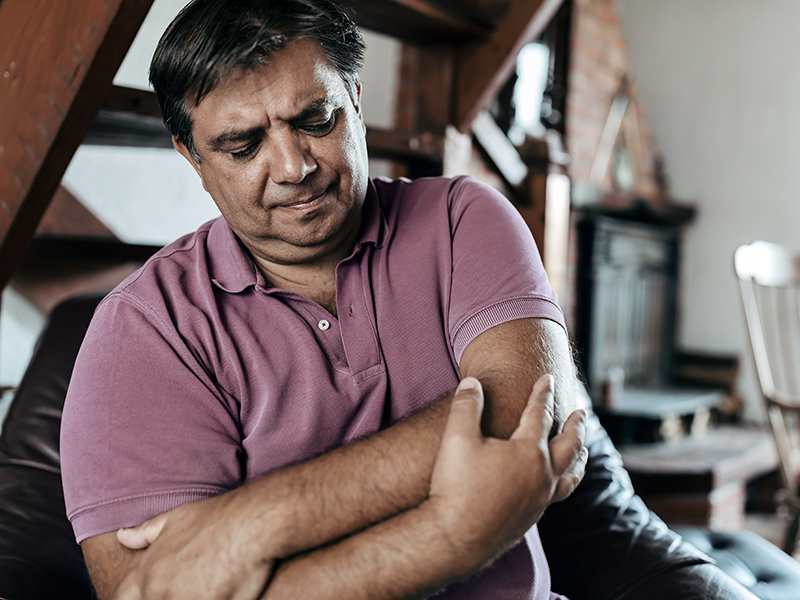 man with elbow pain