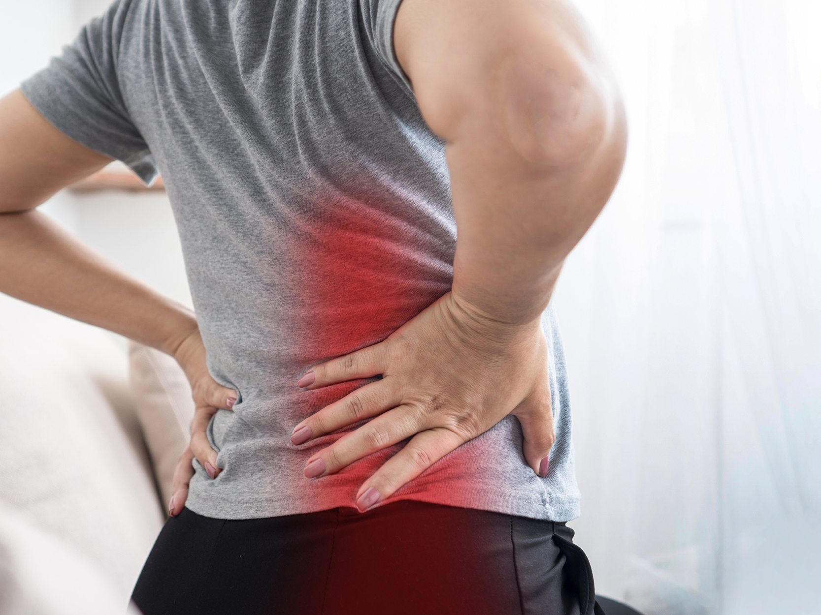 Woman with pain radiating from her lower back