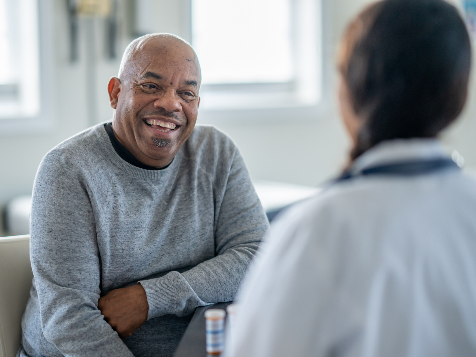 Prostate health CTA - older man with female doctor