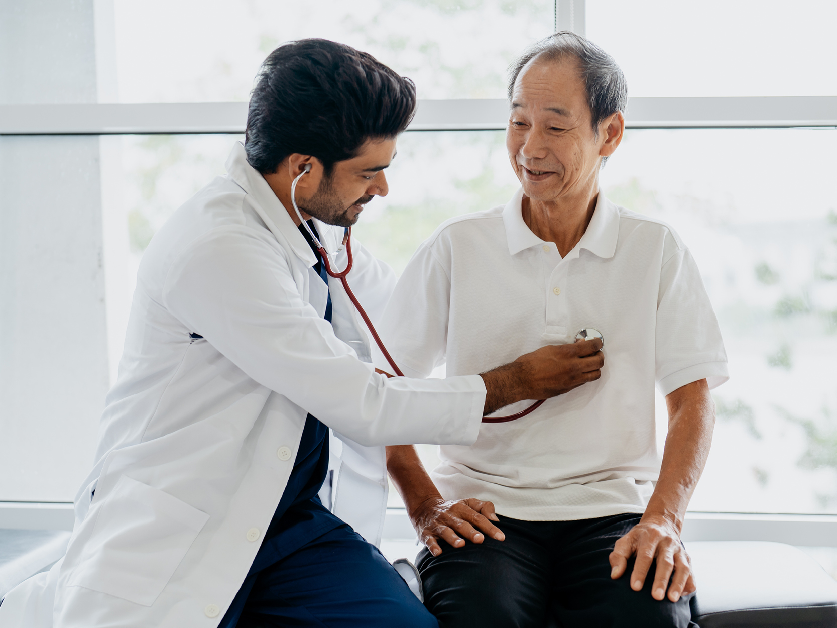 Urologic Cancers CTA - Older man getting examined