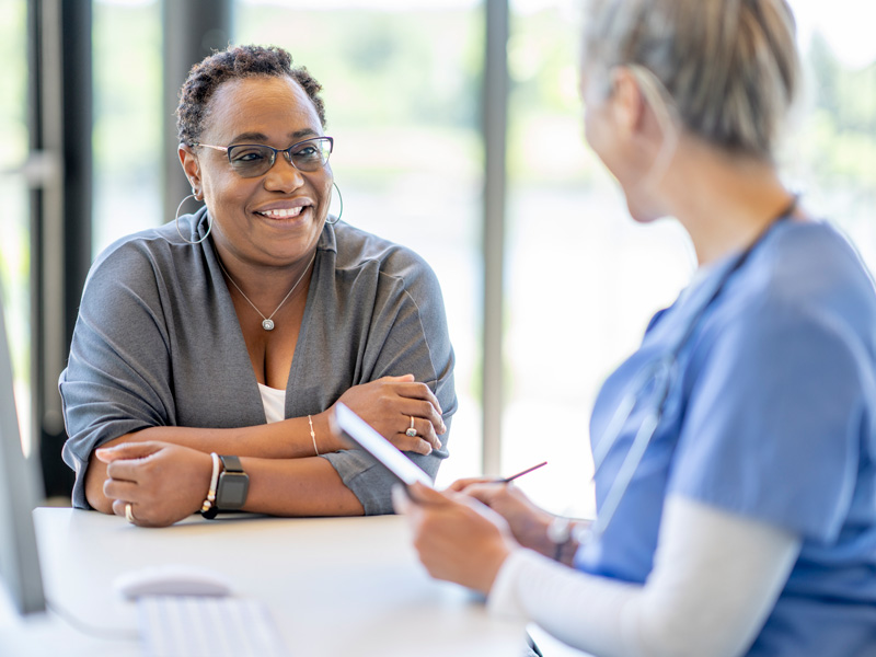 nurse and patient talking