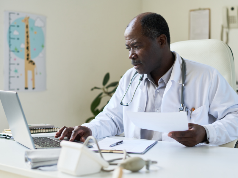 physician reviewing files