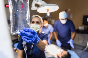 women holding IV Bag